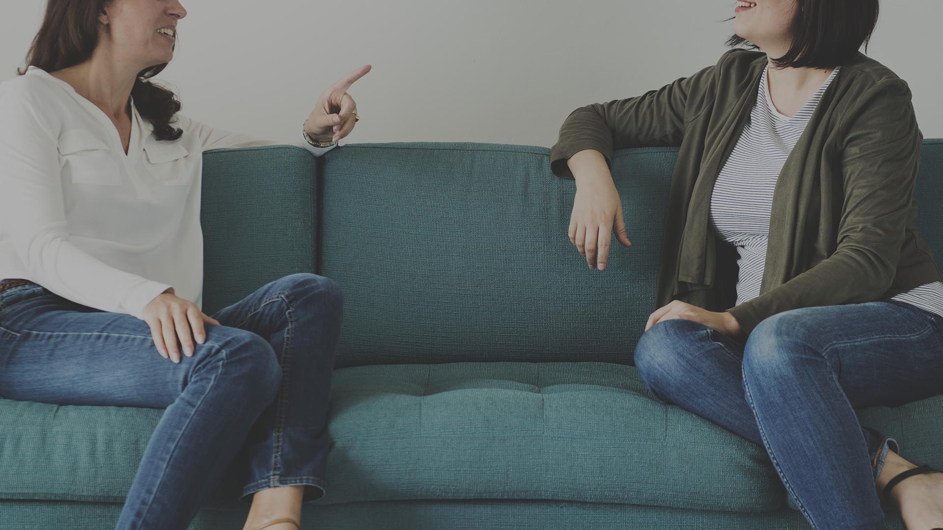Women talking together on the couch